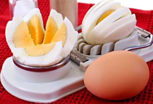 cuted hard-boiled eggs and spices as background